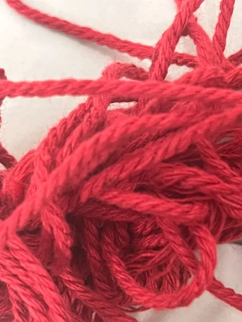 Close-up of thick crimson yarn.